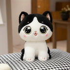 wllio.com grey and white plush cat toy with big sparkling eyes and pink paw pads, and a black and white plush cat toy.